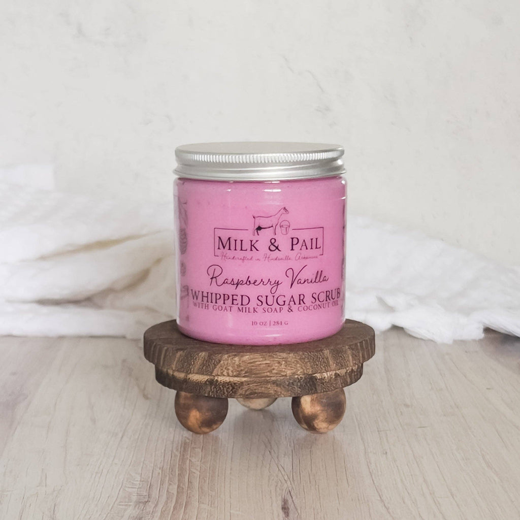 "Raspberry Vanilla Whipped Sugar Scrub 8oz pink jar on a rustic wood riser — The Autumn Hollow"